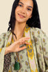 Coat in cotton gauze with asymmetric hemline